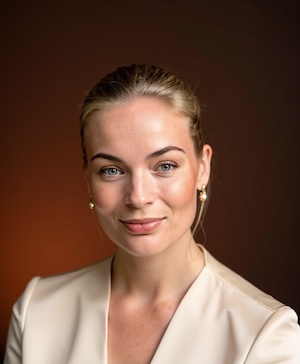 Professional headshot style example with a Chocolate brown background