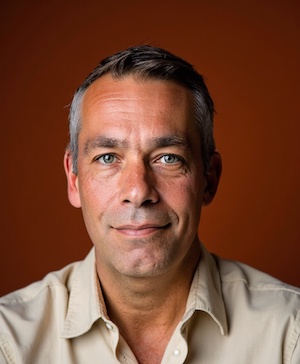 Professional headshot style example with a Terracotta background