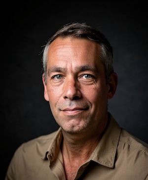 Professional headshot style example with a Charcoal background