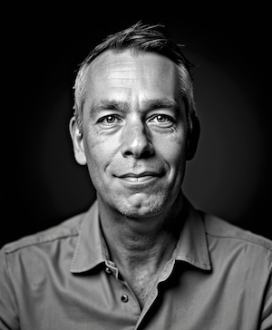 Professional headshot style example with a Black and white on charcoal background